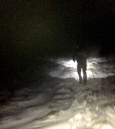 Scenes from the Spine Race: running through the snow in the dark, lit only by a headtorch.