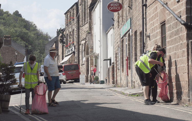 The litter-picking team collect cigarette butts and abandoned napkins from outside a pub in Cromford near our office.