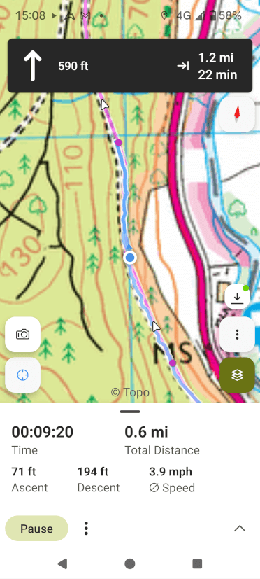 A screenshot of the OutdoorActive navigation app for GPX routes. The user is depicted as a blue dot on a pre-loaded GPX route, overlaid on Ordnance Survey mapping. The app shows how long they've been walking, the distance, ascent and descent they've covered, and a notification of an upcoming turn they need to take.